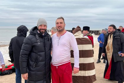 Epiphany was celebrated with the traditional rescue of the cross in the icy waters of Lake Michigan